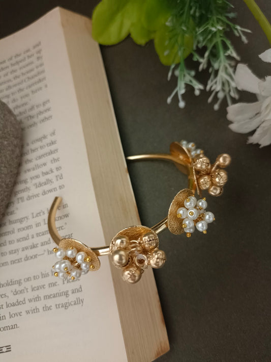 Sanjog Modern Gold-Tone Open Cuff Bracelet with Pearl and Ghungroo Cluster Accents