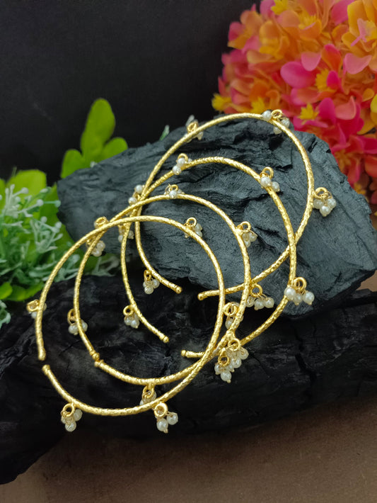Set Of 4 Pearls Studded Gold-Plated Lightweighted Adjustable Bangle-Style Cuff Bracelet