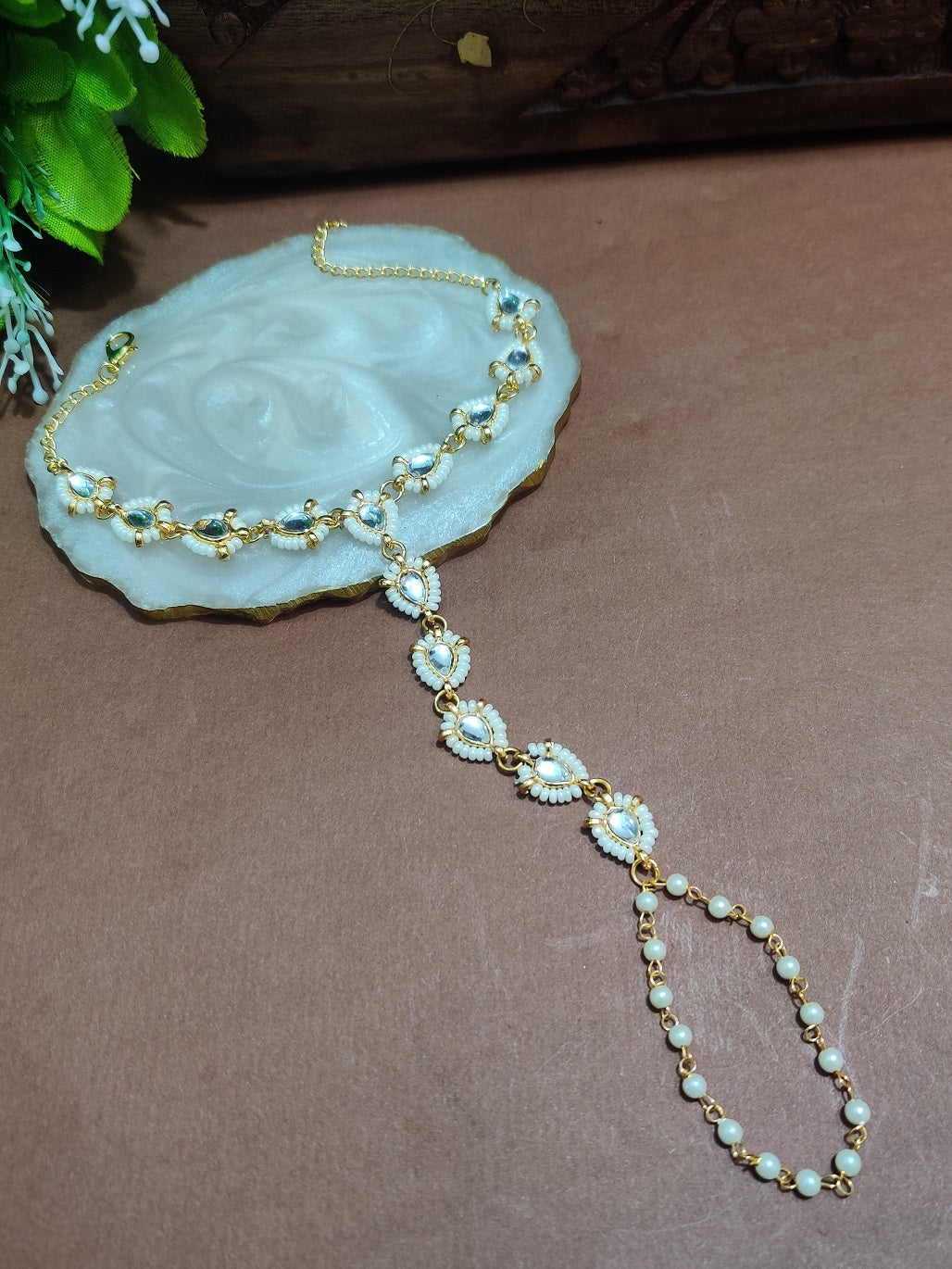 Set Of 2 Gold-Plated Kundan Studded Finger Ring Hathphool Pearl Bracelets
