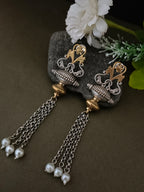 Sanjog Dual-Tone Antique Tribal Drop Earrings with Temple Motifs and Chain Tassels