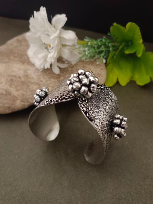 Sanjog Wide Oxidized Silver-Tone Cuff Bracelet with Textured Filigree and Ghungroo Bead Clusters