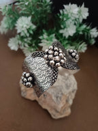Sanjog Wide Oxidized Silver-Tone Cuff Bracelet with Textured Filigree and Ghungroo Bead Clusters